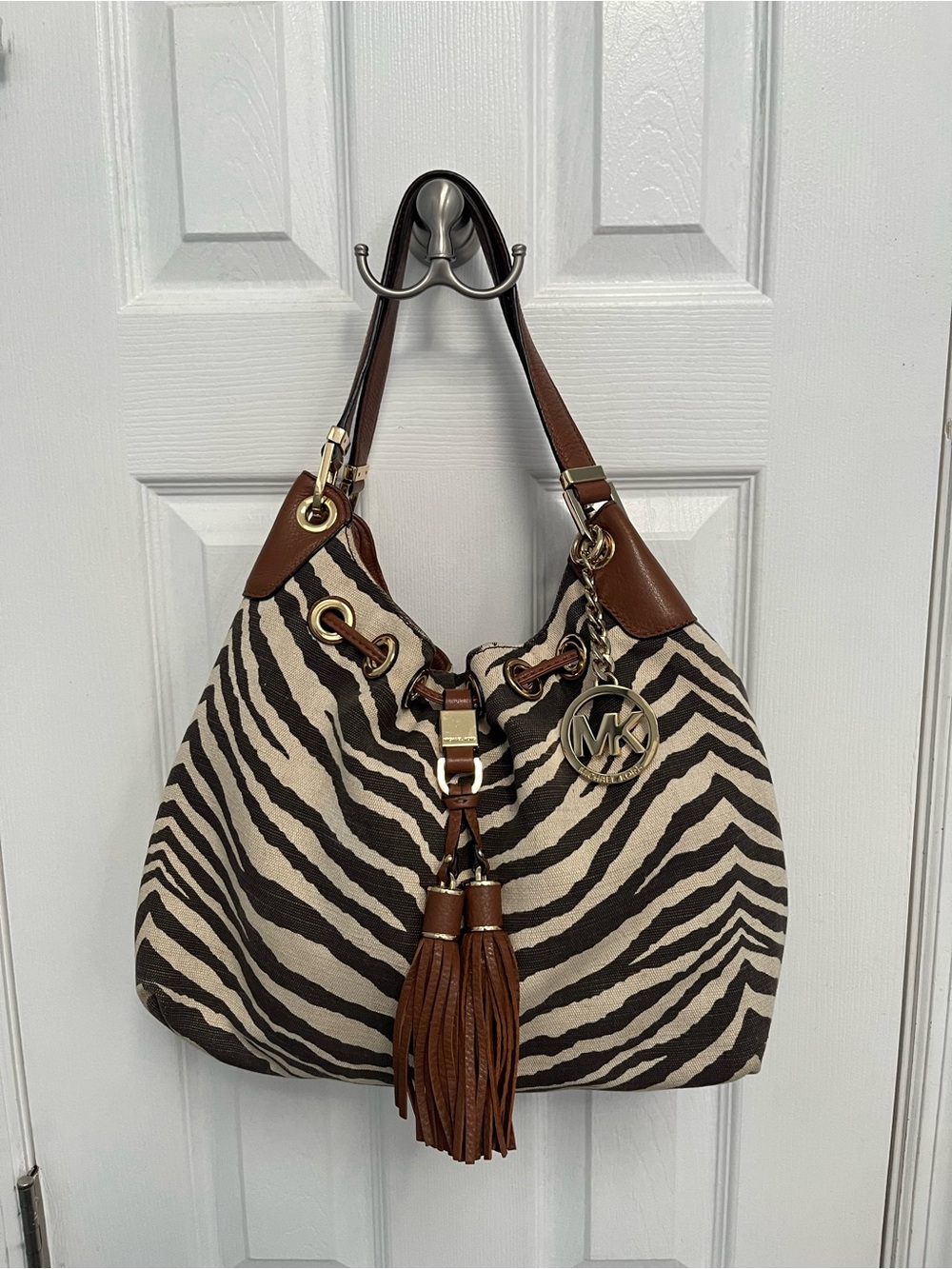 Michael Kors zebra print canvas Marina shoulder bag goldtone tassels Flaws